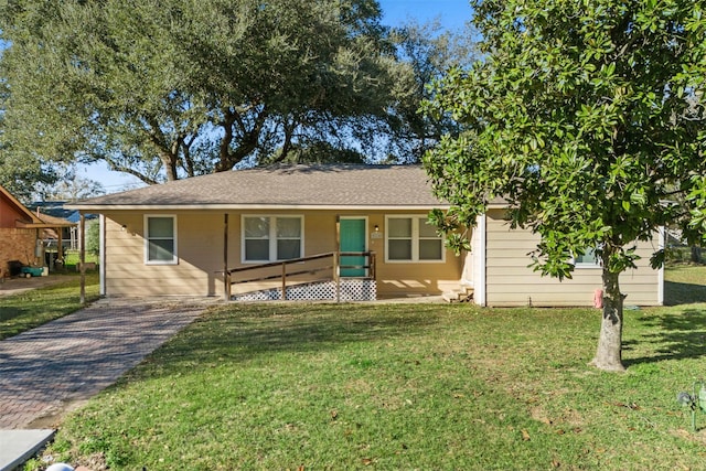 view of front of home with covered porch and a front yard