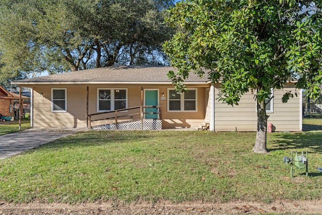 ranch-style house with covered porch and a front lawn