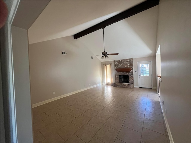 unfurnished living room featuring high vaulted ceiling, a brick fireplace, tile patterned flooring, ceiling fan, and beamed ceiling