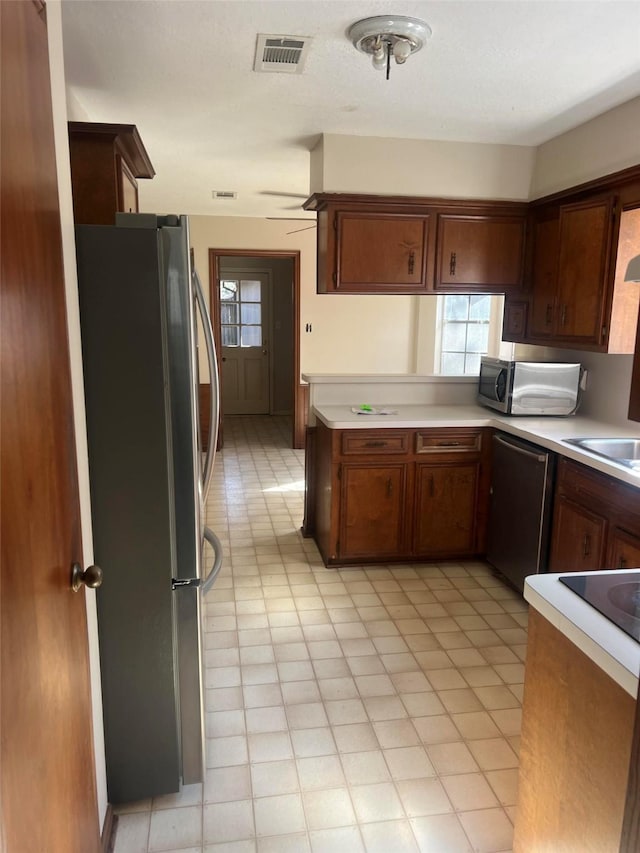 kitchen featuring stainless steel appliances and sink