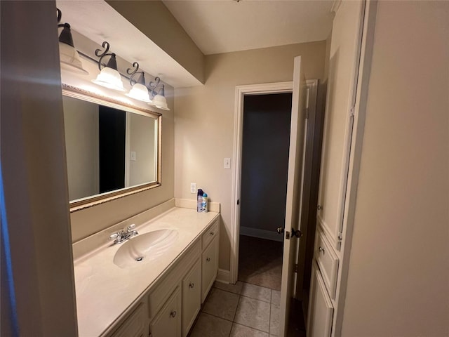 bathroom featuring tile patterned flooring and vanity