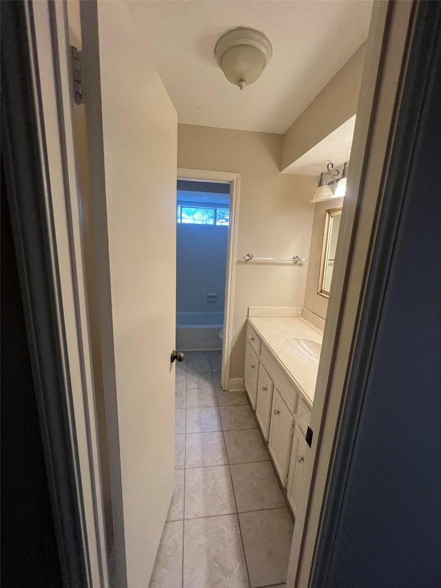 bathroom with tile patterned floors and vanity