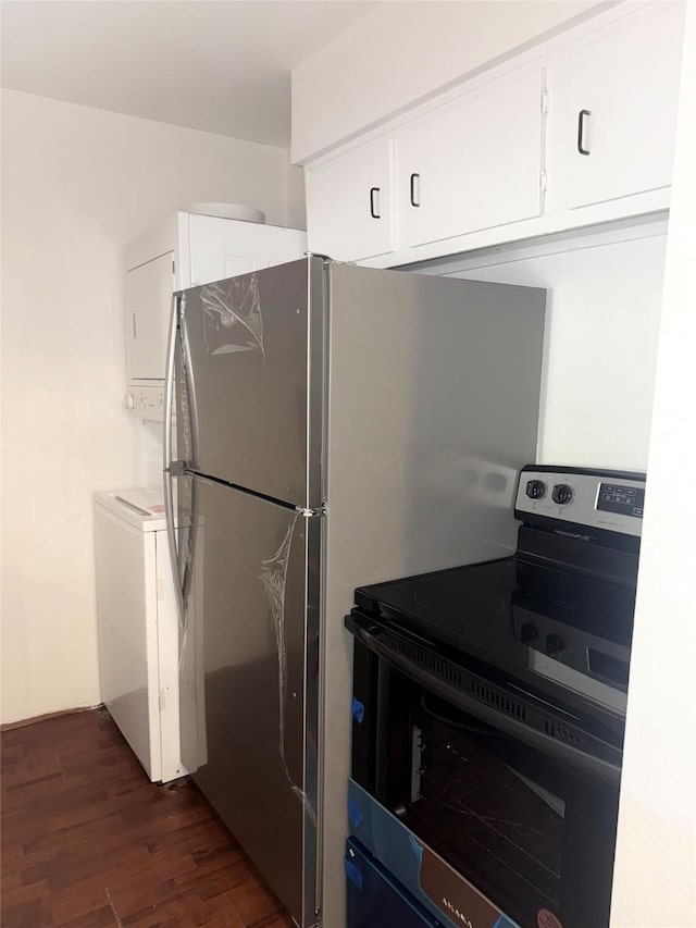 kitchen featuring white cabinets, electric range, and dark wood-type flooring