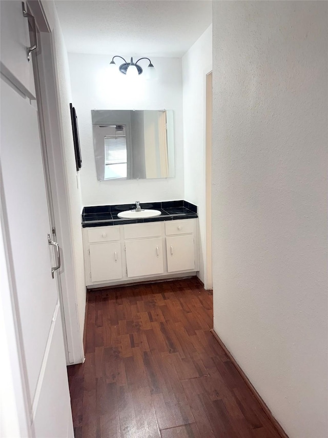 bathroom featuring vanity and hardwood / wood-style flooring