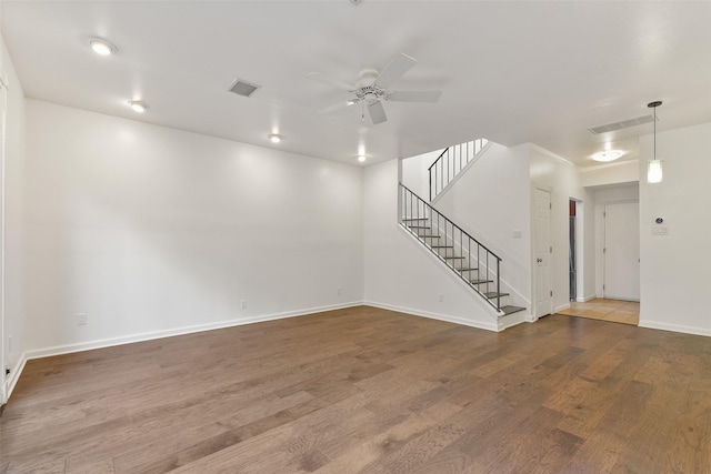 spare room with hardwood / wood-style flooring and ceiling fan