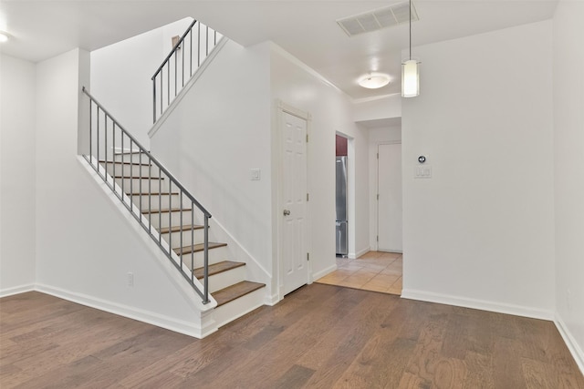 foyer entrance with wood-type flooring