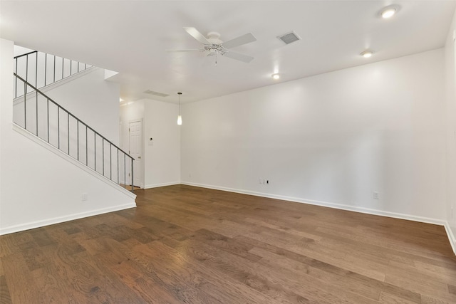 unfurnished living room featuring hardwood / wood-style floors and ceiling fan