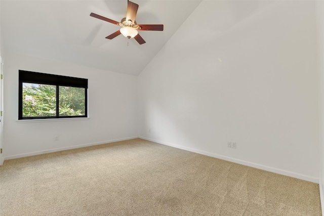 carpeted spare room with high vaulted ceiling and ceiling fan