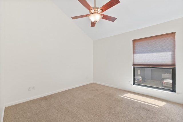 empty room featuring ceiling fan, carpet, and vaulted ceiling