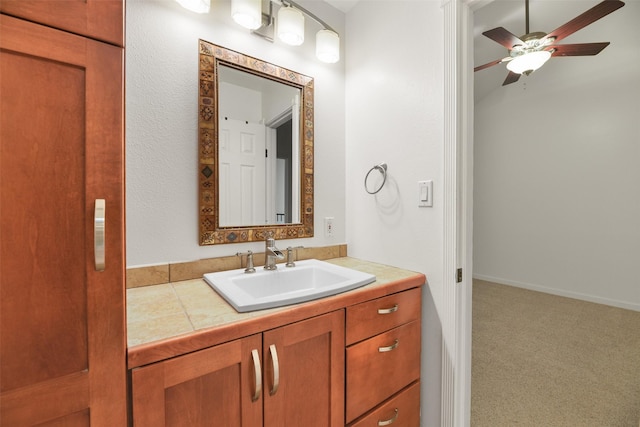 bathroom with ceiling fan and vanity