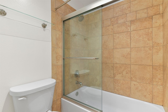 bathroom with shower / bath combination with glass door and toilet