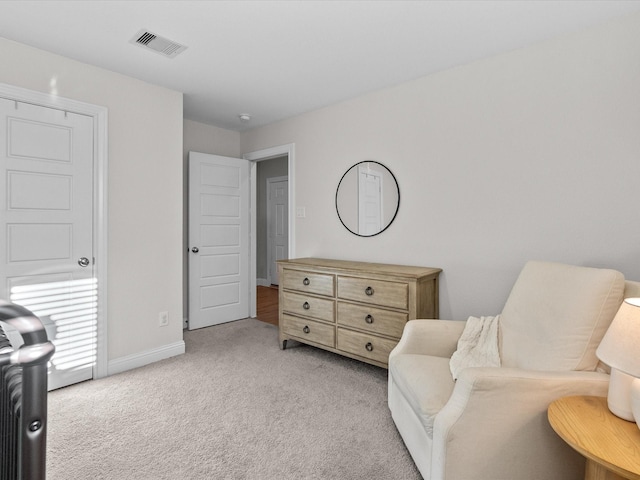 sitting room with light colored carpet