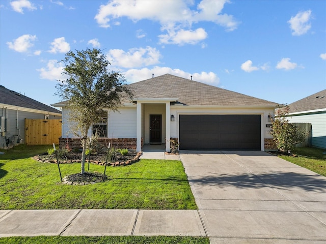 ranch-style house featuring a front lawn, concrete driveway, a shingled roof, a garage, and brick siding