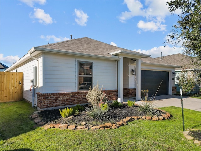 ranch-style house with an attached garage, fence, brick siding, and driveway