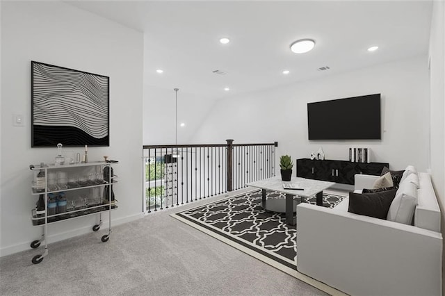 living room with carpet flooring and lofted ceiling