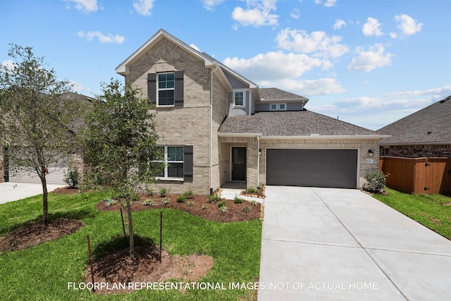 view of front of property with a front lawn and a garage