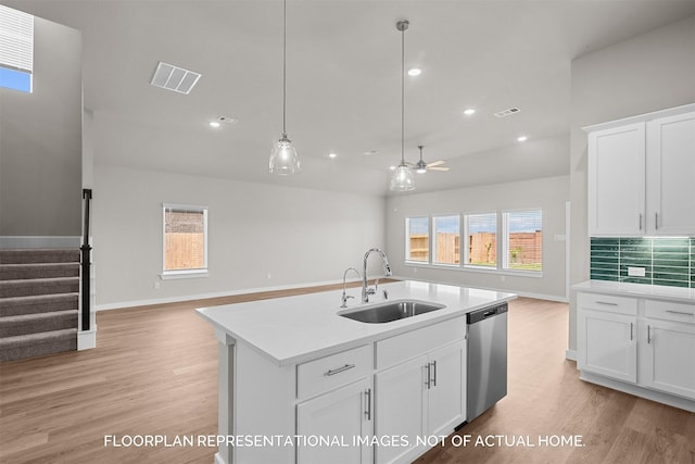 kitchen with backsplash, stainless steel dishwasher, ceiling fan, sink, and white cabinetry