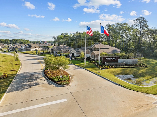 view of community with a residential view and a lawn