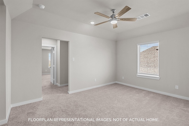 empty room featuring light carpet and ceiling fan