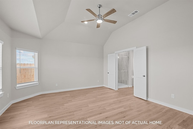 spare room featuring ceiling fan, vaulted ceiling, and light hardwood / wood-style flooring