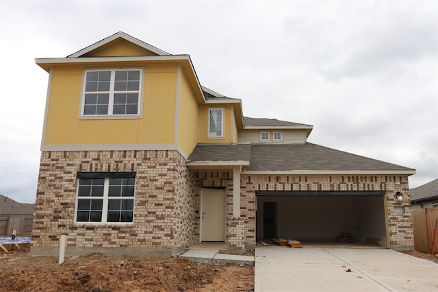 view of front of house featuring brick siding, driveway, a garage, and roof with shingles