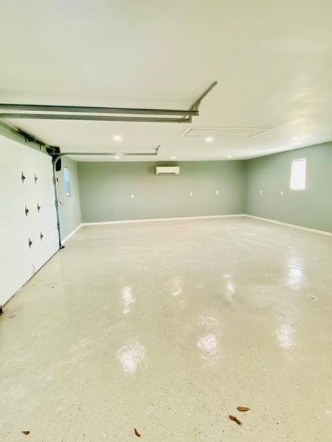 garage featuring a wall unit AC