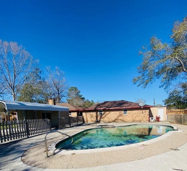 view of swimming pool with a patio