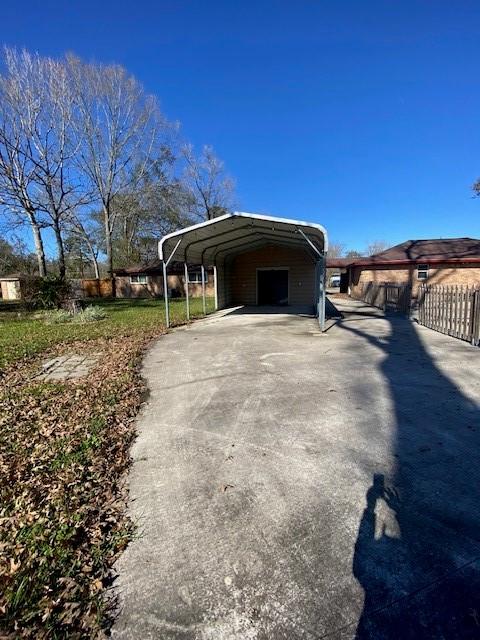 view of property exterior featuring a carport