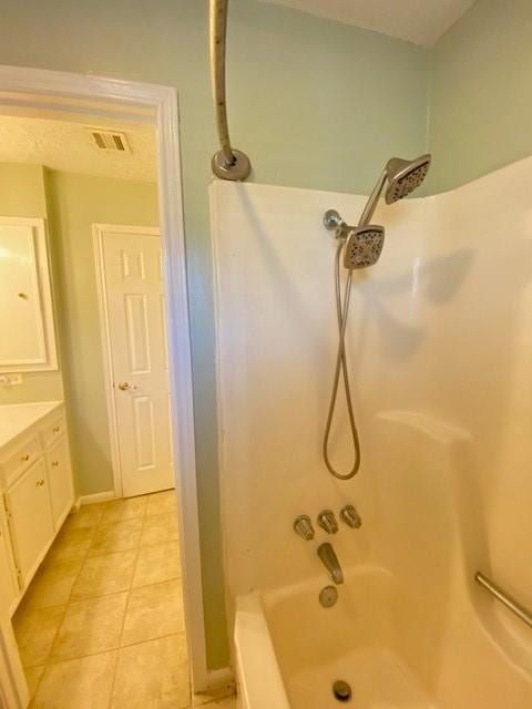 bathroom featuring vanity and tub / shower combination