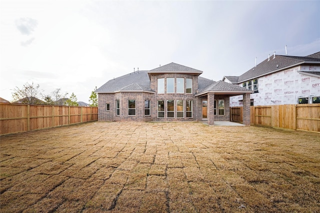 back of property featuring a patio