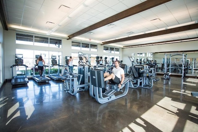 workout area with a towering ceiling