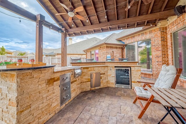 view of patio with wine cooler and ceiling fan