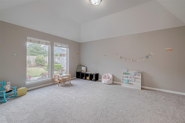 rec room with carpet and lofted ceiling