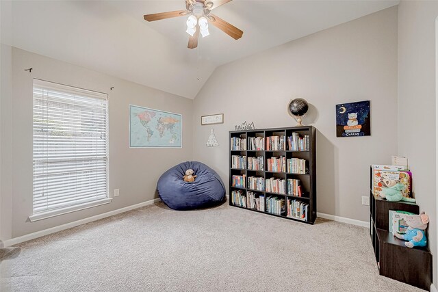 misc room featuring light colored carpet, vaulted ceiling, and ceiling fan