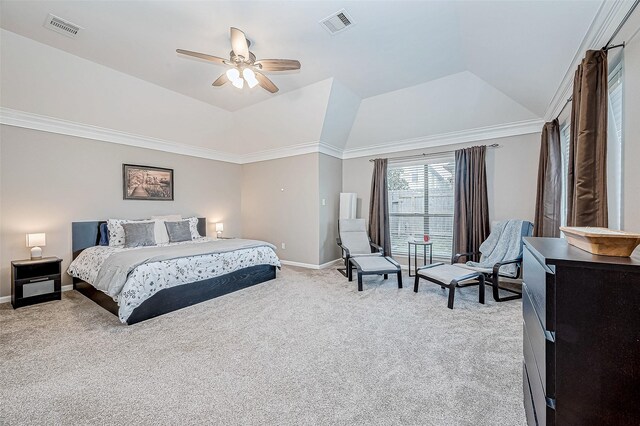 bedroom with light carpet, a tray ceiling, ceiling fan, and crown molding