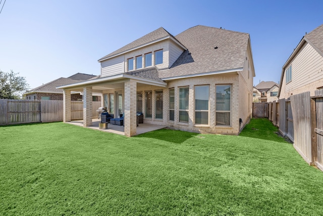 back of house with an outdoor hangout area, a patio area, and a yard