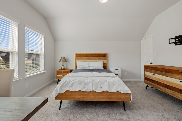 carpeted bedroom with vaulted ceiling