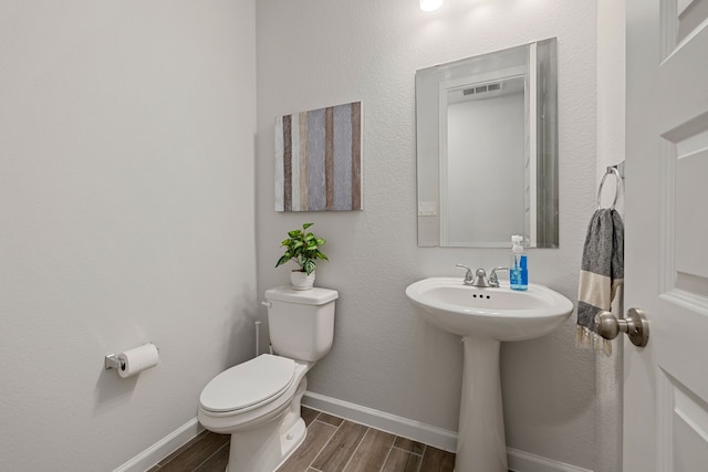 bathroom with toilet and sink