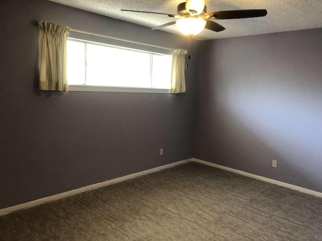 909 Silber Rd Unit 4A, Houston, TX 77024 - unfurnished room featuring baseboards, a ceiling fan, and a textured ceiling