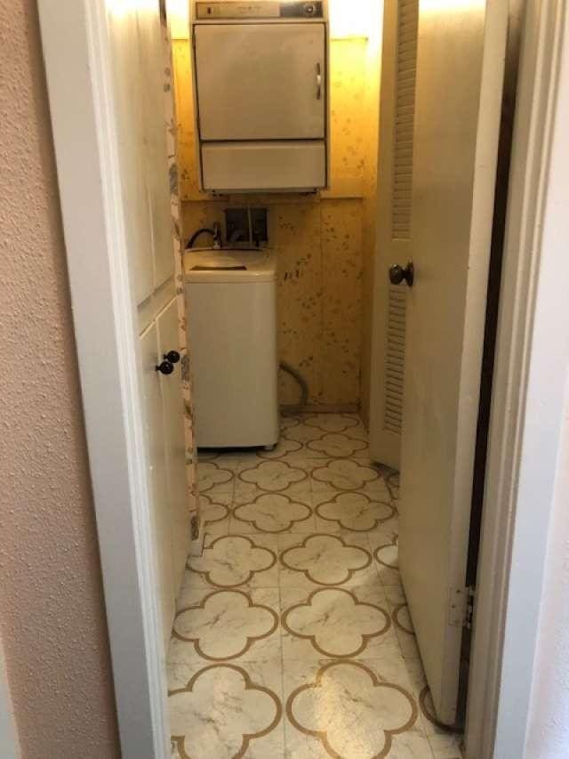 909 Silber Rd Unit 4A, Houston, TX 77024 - clothes washing area with washer / dryer and light floors