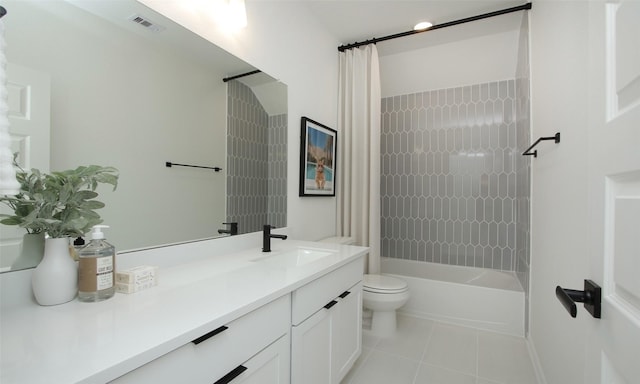 full bathroom featuring tile patterned floors, shower / bath combo, toilet, and vanity