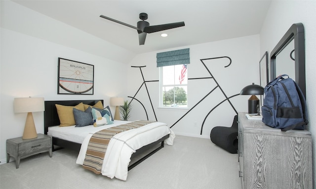 carpeted bedroom featuring ceiling fan and lofted ceiling