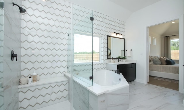 bathroom with vanity and separate shower and tub