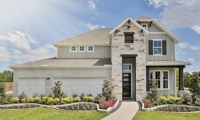 view of front facade with a garage and a front lawn