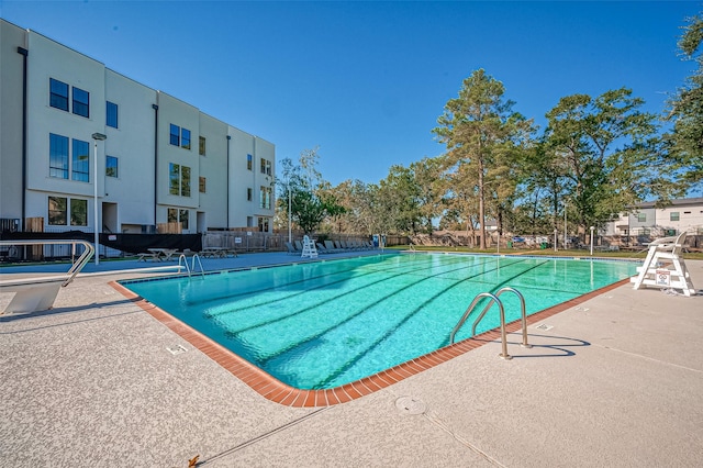 view of swimming pool with a patio area