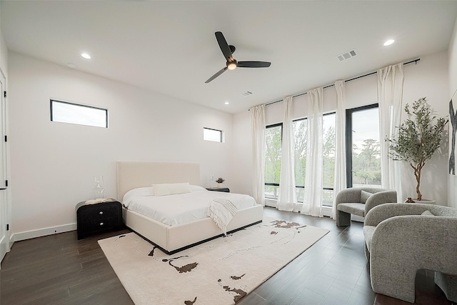 bedroom featuring ceiling fan, access to exterior, and dark wood-type flooring