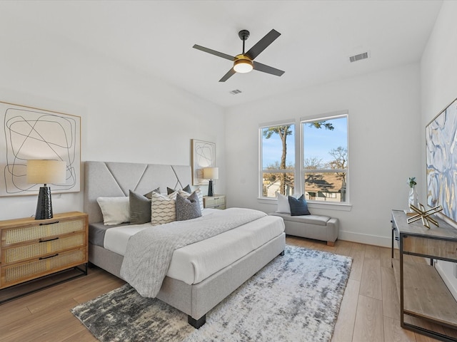 bedroom featuring light hardwood / wood-style flooring and ceiling fan