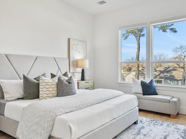 bedroom with hardwood / wood-style flooring