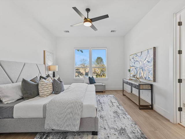 bedroom with light wood-type flooring and ceiling fan