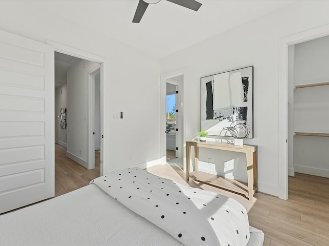 bedroom featuring light hardwood / wood-style floors and ceiling fan